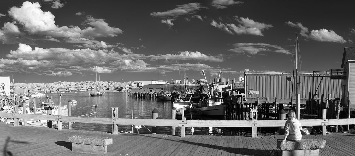 Infrared Panorama of Fishing Port Basin with Seated Womand to the Right.